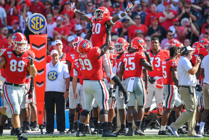 NT, Jordan Davis celeberates with J.R. Reed.
